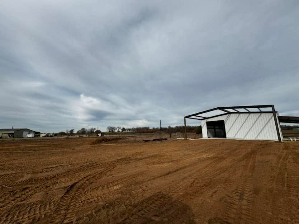 Graded building pad in front of a new metal shop building